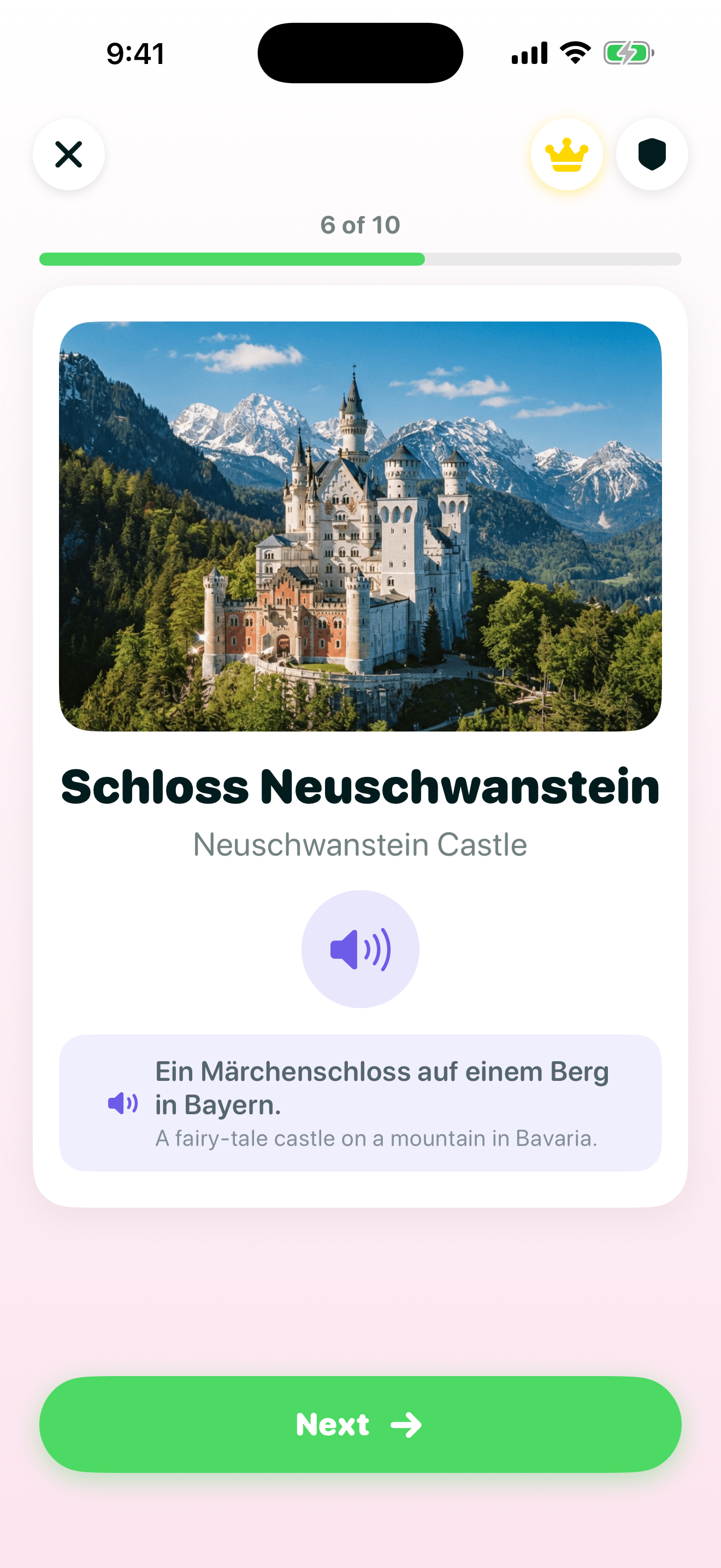 General Knowledge lesson screen showing an aerial photo of Schloss Neuschwanstein (Neuschwanstein Castle) in the Bavarian mountains, with a German caption and English translation